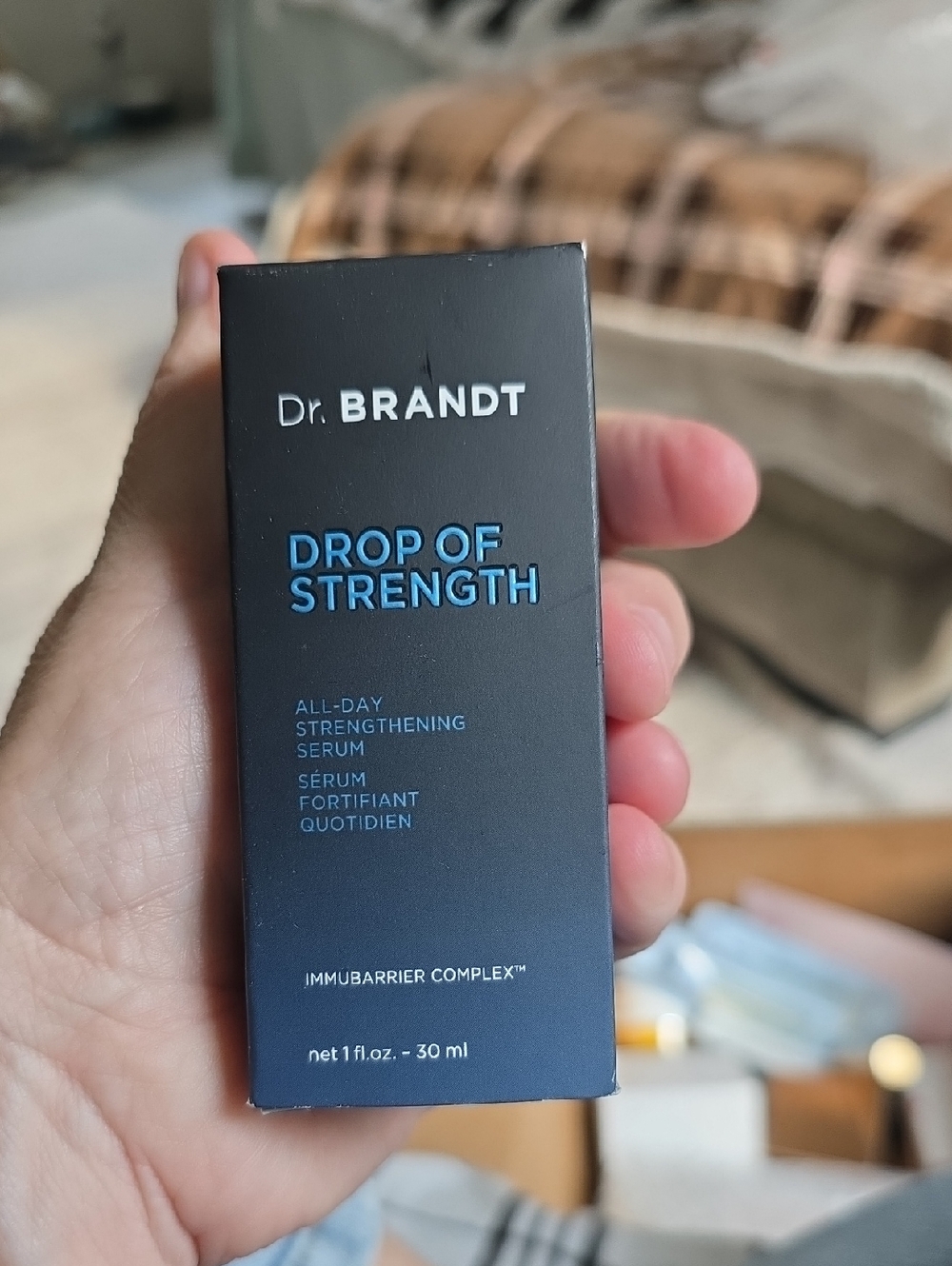 Dr. Brandt Drop of Strength Serum in Blue and Black Packaging